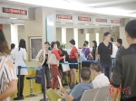 房产新政暖热房市 带动房产交易中心业务办理